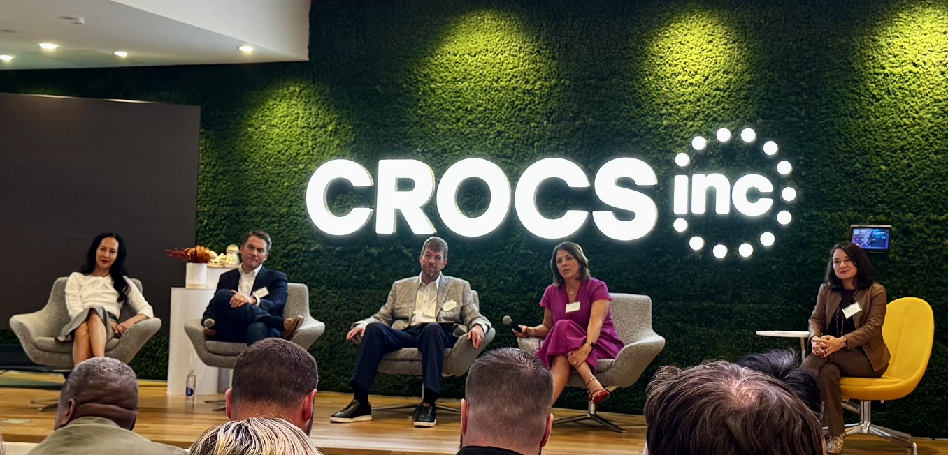 Executive Voices panel discussion at Crocs Global Headquarters, with five leaders seated before the audience