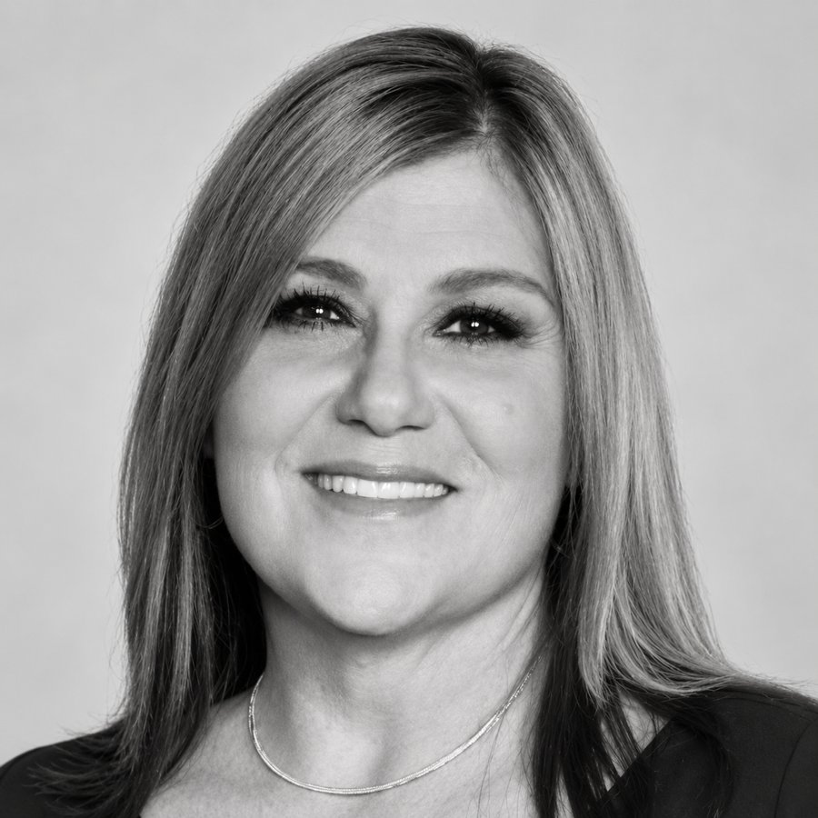 Black-and-white studio portrait of Kristin Crockett, executive coach and senior facilitator